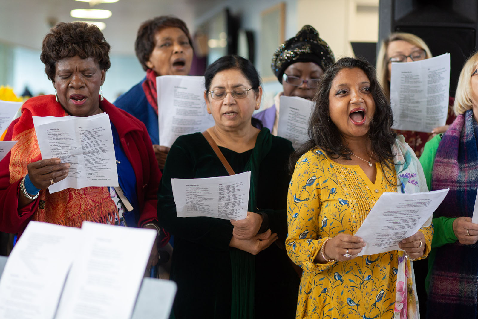 group of women singing in a choir